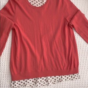 Pullover sweater with attached layer